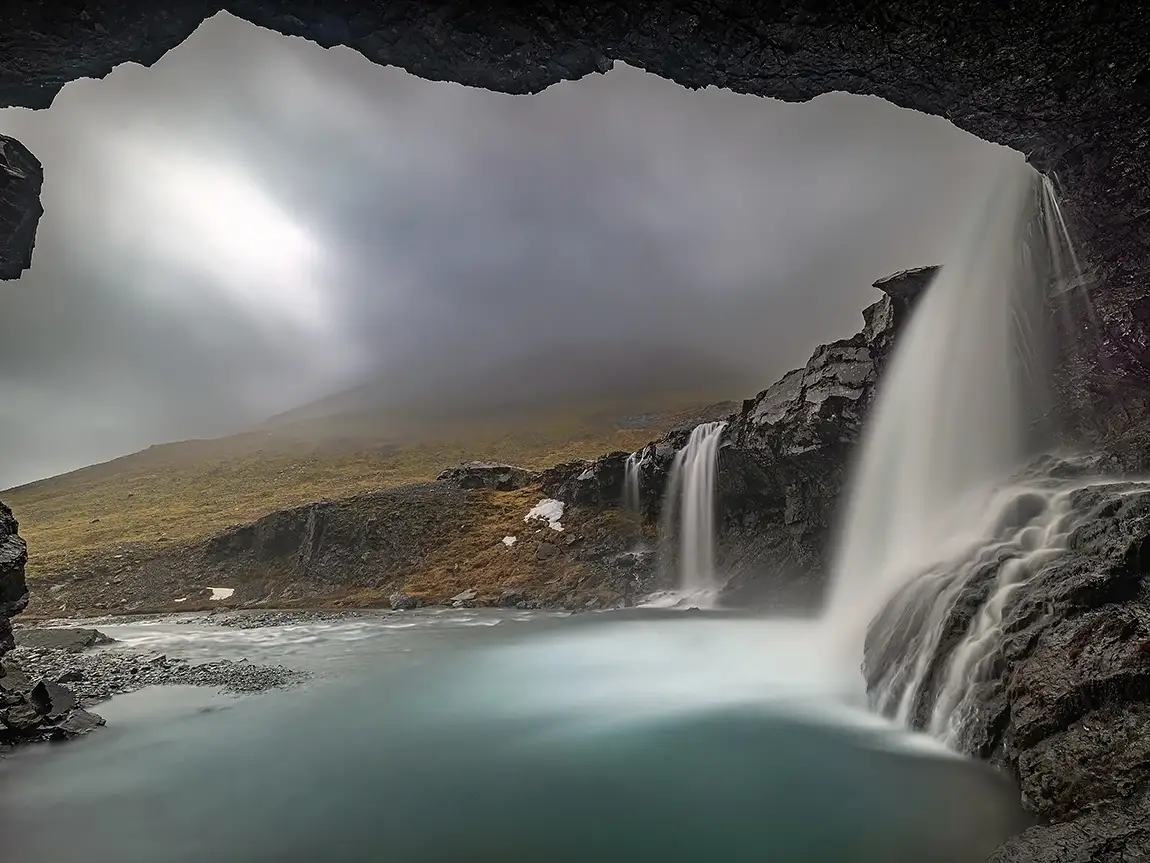 Under a moody weather waterfall, skutafoss, iceland
