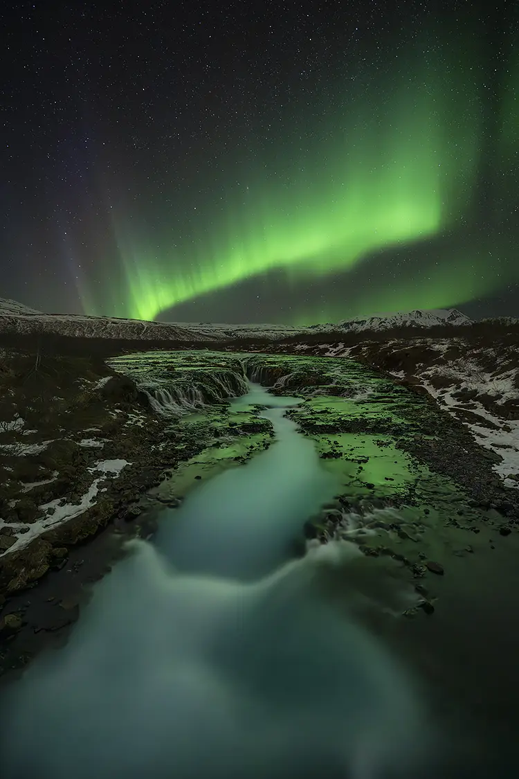 Aurora over bruarfoss, golden circle, southwest iceland