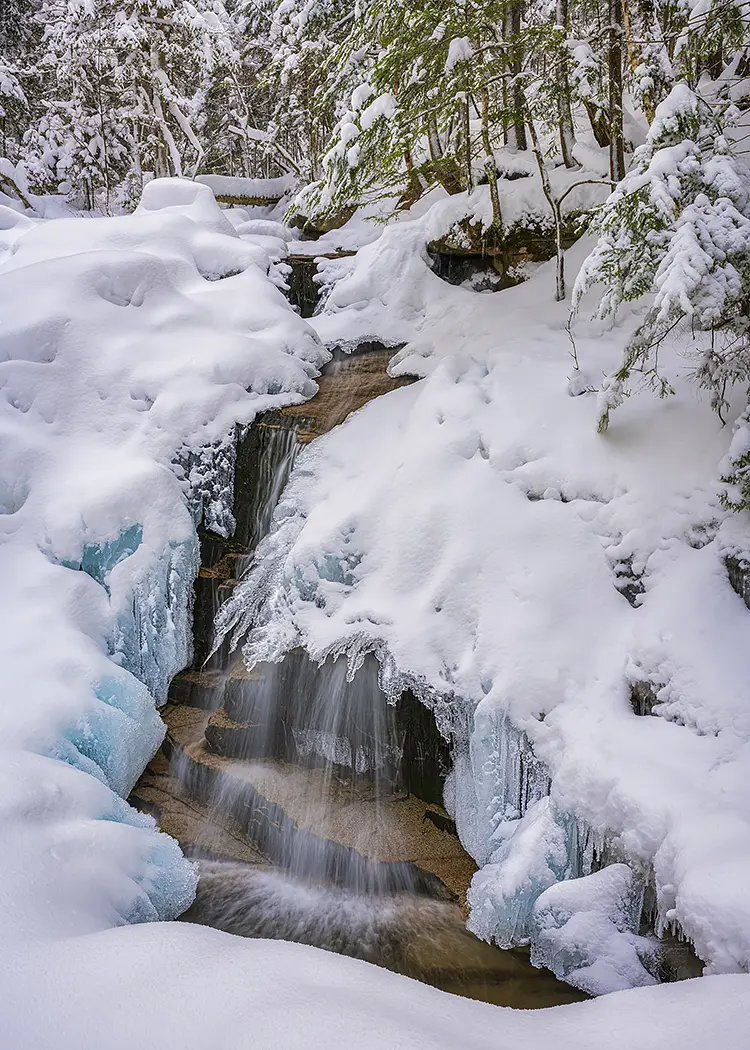 Winter at stairs falls, franconia notch state park, lincoln, new hampshire, usa
