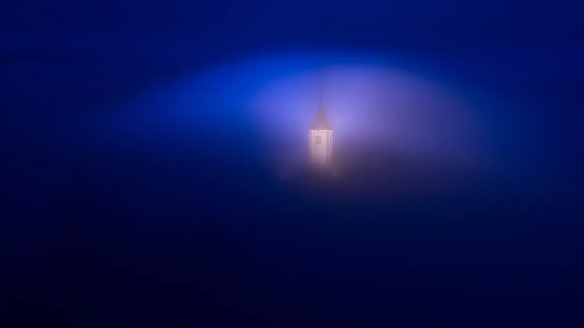 Dawn mist at jamnik church, near kropa, slovenia