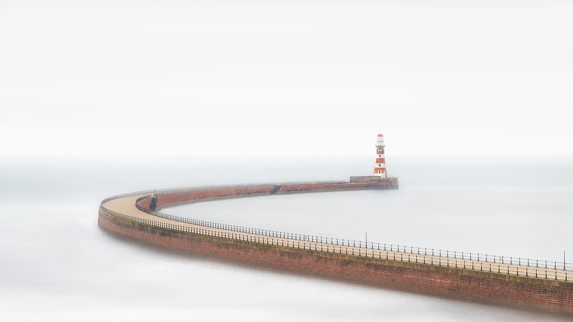 Foggy curved pier and roker lighthouse, sunderland, tyne and wear, england