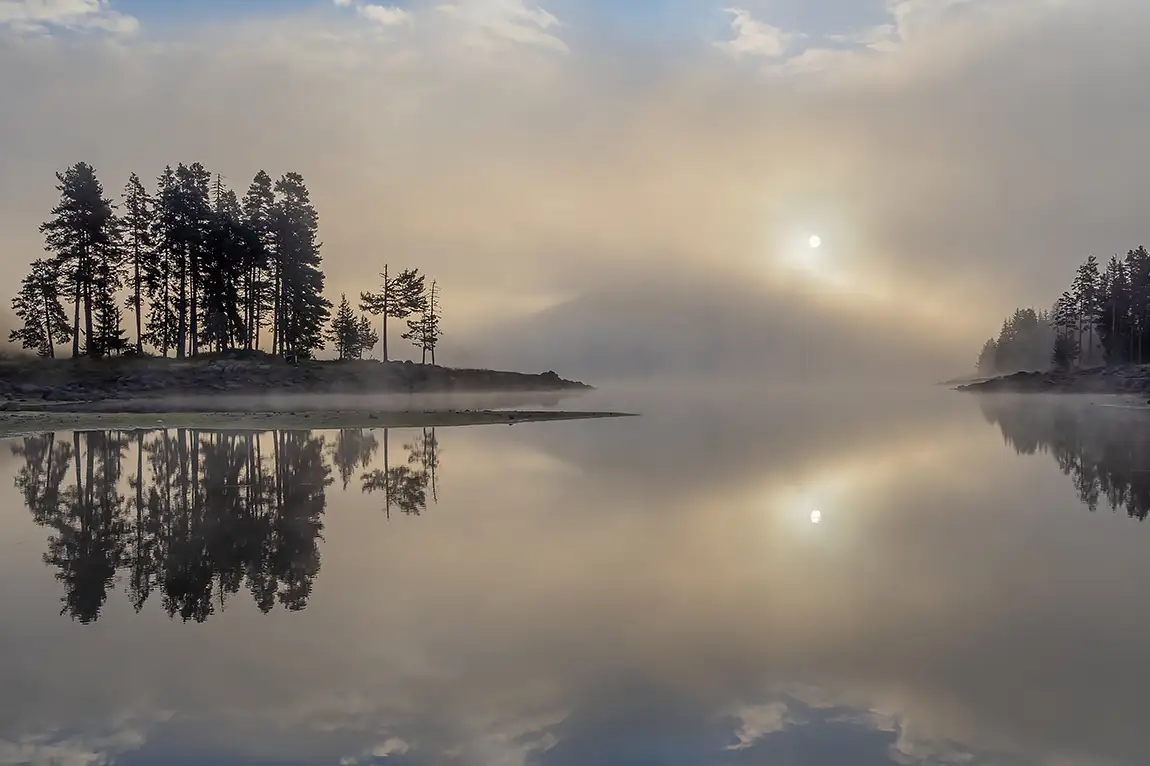 Sunrise over shiroka polyana dam, rhodope mountains, bulgaria