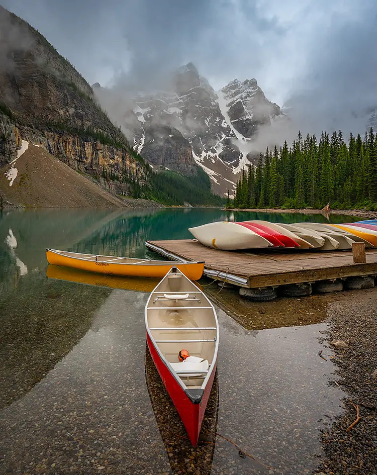 Canoes At Moraine Lake, Banff National Park, Canada