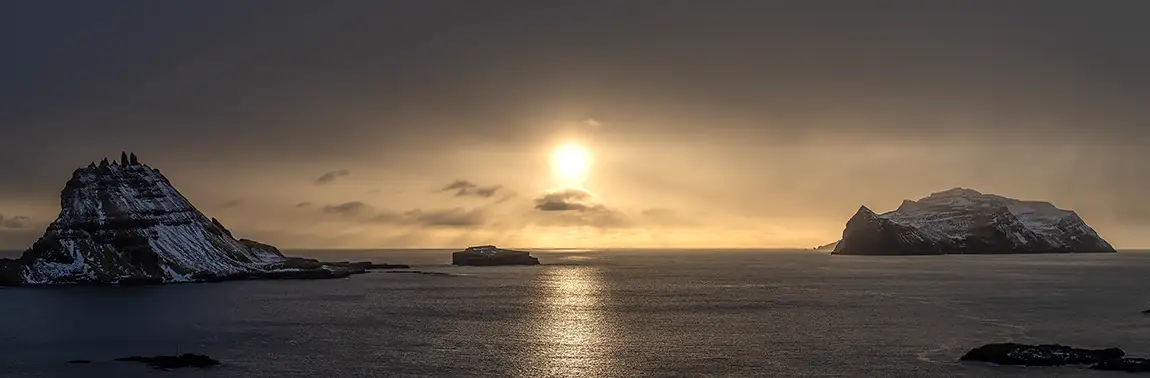 Sun Dips Below Clouds, Near Bour, Faroe Islands