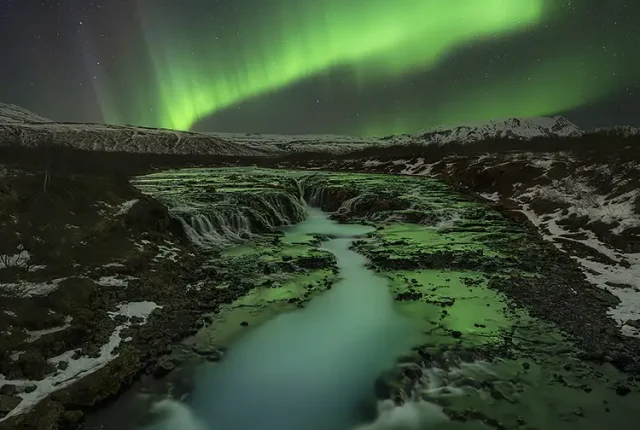 Aurora over bruarfoss, golden circle, southwest iceland
