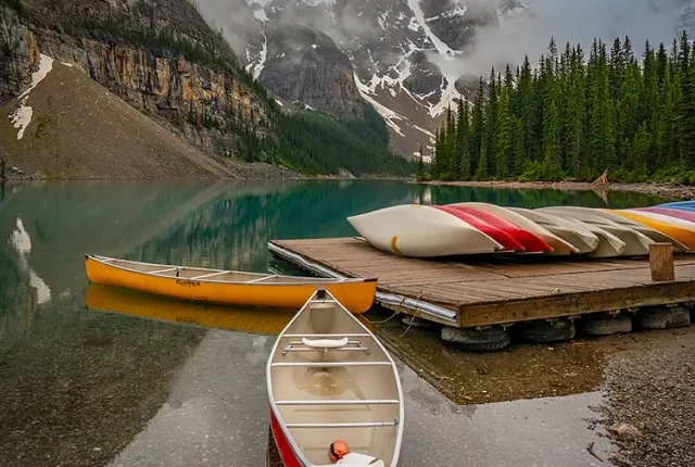 Canoes At Moraine Lake, Banff National Park, Canada