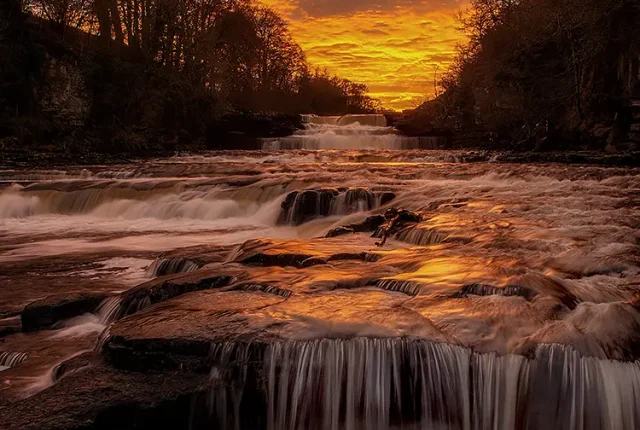 Fire in the water, aysgarth falls, north yorkshire, england