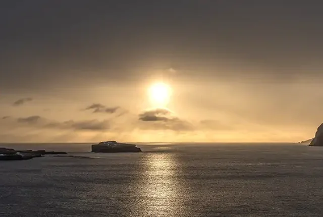 Sun Dips Below Clouds, Near Bour, Faroe Islands
